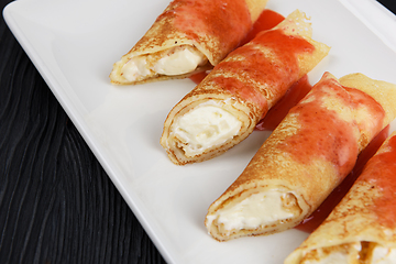 Image showing Pancakes stuffed with cream