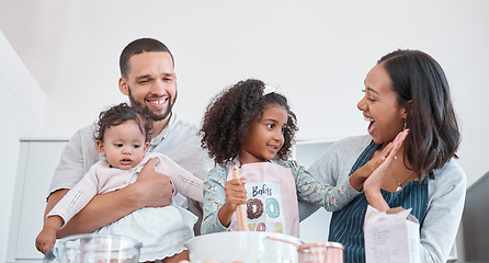 Image showing Family, cooking and learning with high five for success from supportive mother in home kitchen. Teamwork, achievement and happy parents proud of baker skills of child mixing cake ingredients.