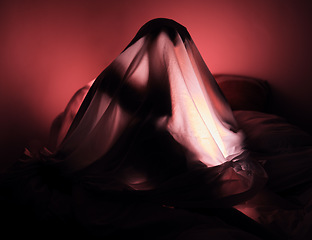 Image showing Depression, fear and red with a woman in bed, alone with her thoughts, while sitting under a blanket. Stress, scared and bedroom with a sleepless female covered with a duvet at night in a house