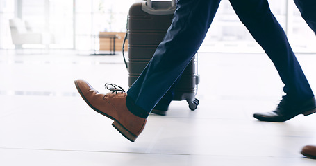 Image showing Businessman in shoes, travel with suitcase and walking in hotel building commute to work trip in New York. Corporate leadership example, feet on airport ground and steps to success in company office