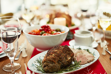 Image showing Background, roast beef and thanksgiving food on dining table for dinner party, celebration and christmas, family lunch and meal at home. Closeup of ham, meat and festive feast in fine dining room