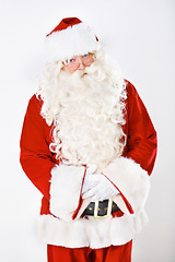 Image showing Portrait of father Christmas in studio with white background in a red costume for Christian winter holiday celebration. Marketing, senior or santa claus face with sales offer, promo or discount deals