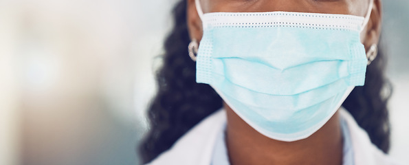 Image showing Black woman in healthcare, covid and a doctor with a face mask closeup. Safety, security and risk for employee working in the medical field. Medicine, caution and insurance of a safe work environment