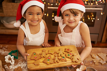 Image showing Christmas, cookies and portrait of children in kitchen for cooking, holiday or festive celebration. Smile, friends and baking with kids at home with gingerbread dessert for content, xmas or tradition