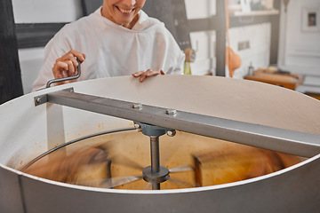 Image showing Machine, beekeeper and honey in production in a factory at sustainable, agriculture and agro bee farm. Mixer, manufacturing and woman farmer in warehouse to produce organic, natural and raw honeycomb