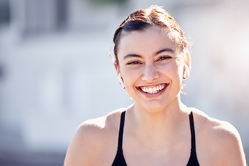 Image showing Earphones, face and sports woman in city streaming music, podcast or radio. Portrait, fitness and female from Australia outdoors listening to audio and getting ready for training, running or workout