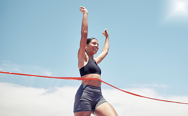 Image showing Fitness, winner and sports woman running a race and winning first place in summer in track competition. Runner, goals and happy girl athlete with hands up smile in celebration of a marathon success