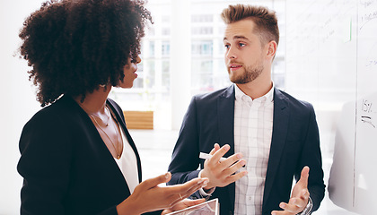 Image showing Diversity, black woman and businessman brainstorming on a whiteboard in a meeting for a strategy, innovation or solution. Ideas, teamwork and creative startup company developer talking to an employee