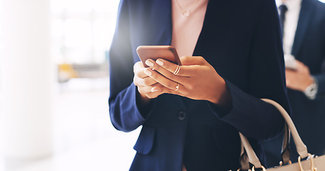 Image showing Business woman, phone and hands texting in communication, social media or chatting at the office. Hand of female employee reading, typing or browsing on mobile smartphone at the workplace