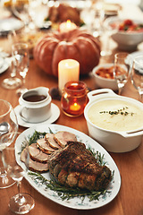 Image showing Thanksgiving, food and meat on dining table in house, empty home or restaurant for holiday celebration, dinner party or healthy lunch. Zoom, texture and festive meal with roast beef slices or turkey