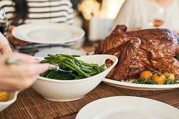 Image showing Food, thanksgiving and hands serving lunch at table with care for family, friends and loved people. Celebration, turkey and traditional festive holiday meal for togetherness, thanks and gratitude.