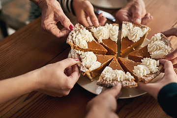 Image showing Party, pumpkin pie and hands of people at table for thanksgiving, celebration and festive holiday. Food, dessert and community with family and dinner for event, traditional and social gathering