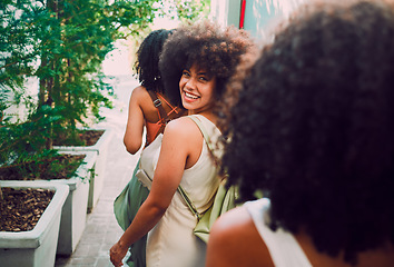 Image showing Friends walking, travel and city with black woman, adventure and happiness on summer vacation. Happy women, african girl and walk in metro, urban town or street for bonding, relax and exploring Paris