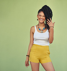 Image showing Fashion, portrait and natural black woman with braids enjoying youth, vacation and summer freedom. Happy, wellness and excited smile of young Jamaican girl standing at green background mock up.