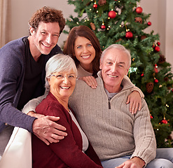 Image showing Happy family, portrait and grandparents home for Christmas to celebrate together with daughter and son. Elderly parents, man and woman love spending quality time or bonding on sofa in winter holidays