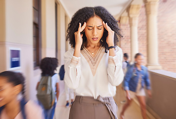 Image showing Headache, tired and stress teacher in school with fast children thinking of work stress, education mindset and management challenge in hall. Black woman sad, angry and pain with speed or busy campus