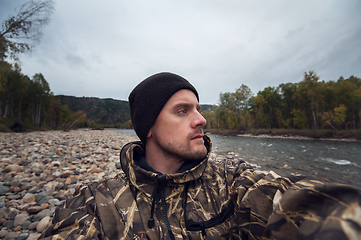 Image showing Caucasian man in the mountain making selfie