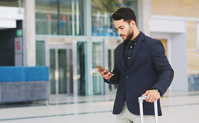 Image showing Businessman, phone and luggage in airport, travel and check flight, time, schedule and online communication. Corporate worker, international travelling and company convention with mobile smartphone