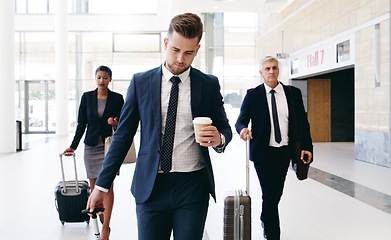 Image showing Travel, international meeting and business people walking in hotel, airport and reception area with suitcase. Teamwork, collaboration and group of managers travelling for global business meeting