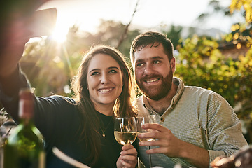 Image showing Couple, happy selfie and wine at vineyard, wine farm and smile on holiday, vacation and outdoor. Woman, man and wine glass in digital photo in summer sunshine, together and love in Marseille, France