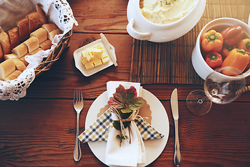 Image showing Above, lunch celebration and food on table for holiday, Sunday dinner or party. Table setting, nutrition and feast at a dining room table for a dinner party, fine dining and foods at a place setting