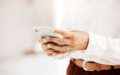 Image showing Hands, phone and social media texting for communication or chatting against a blurred background. Hand of employee worker reading, typing or having a conversation on mobile smartphone at the office