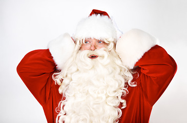 Image showing Confused, santa claus and man in studio for wow, shock and surprise against a white background mockup. Christmas, costume and elderly man mind blown by good news, announcement and festive spirit