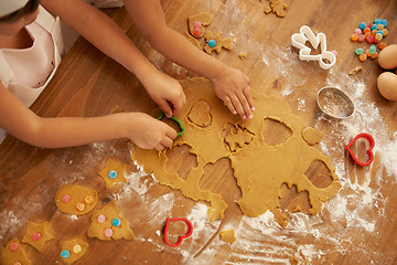 Image showing Top view, children hands and baking with cookie cutters in house or family home kitchen with pastry, eggs or sweets. Kids, girls or bonding siblings cooking breakfast biscuits, dessert and wheat food