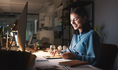 Image showing Work, overtime and woman reading smartphone with tablet and computer working late on online design project. Night at office, happy designer networking for creative startup and checking social media.