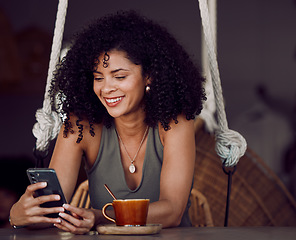 Image showing Black woman, phone and coffee in cafe, restaurant or coffee shop on social media, internet news or fun esports game. Happy smile, relax afro student and entrepreneur with tea cup or mobile technology