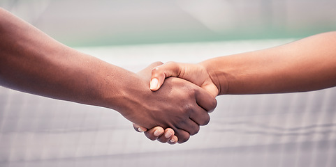 Image showing Closeup, handshake and sport for support, teamwork or respect outdoor at tennis court with diversity. Shaking hands, training and sports for fitness, exercise or training together with tennis player