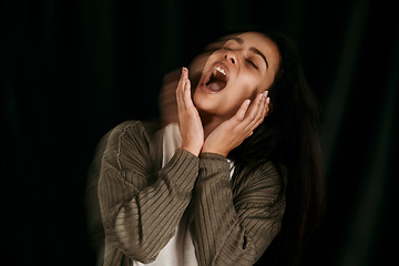 Image showing Woman with bipolar crying, frustrated or anxiety on black studio mockup for psychology and mental health. Trauma, schizophrenia or angry girl shout with depression, fear and mental illness.