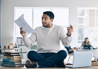 Image showing Student, stress and mental health, paper and anxiety while sitting on table in education hall, laptop and studying. Young man, study and frustrated while learning university, college or school campus