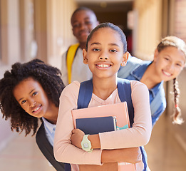 Image showing Education, children and portrait of friends at school together standing in the hallway for class. Diversity, backpack and happy students with a smile playing in the corridor of the campus with books.