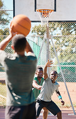 Image showing Basketball court, games and competition, friends and outdoor sports, fitness and energy of goals, performance and action. Basketball player group, men and team challenge, defending and urban training