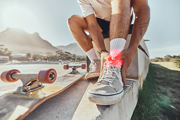 Image showing Skateboard man, injury and ankle pain, legs and outdoor accident, emergency or first aid risk with red glow at skatepark. Joint pain, bone health and wound fracture of skateboarder in sports accident