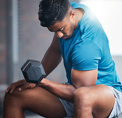 Image showing Fitness, dumbbell and man training in a gym for strong muscles, biceps development and powerful arms. Focus, sports and bodybuilder weightlifting heavy weights with concentration curls exercise