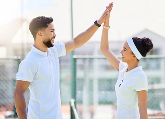 Image showing Tennis, high five and motivation with a sports couple in celebration of an achievement as a winner team. Fitness, workout and success with a man and woman tennis player on a tennis court together