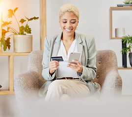 Image showing Online shopping, smile and woman with phone and credit card sitting on armchair in living room. Ecommerce, happy shopping and girl surfing internet retail website for sale or discount with budget.