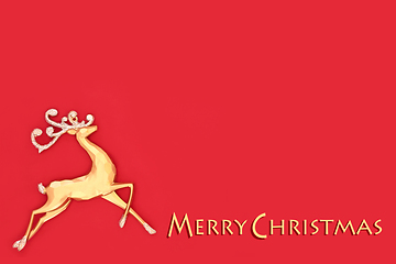 Image showing Merry Christmas Gold Reindeer on Red Background