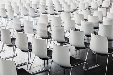 Image showing Empty white chairs in contemporary conference hall