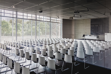 Image showing Empty white chairs in contemporary conference hall