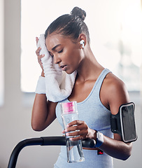 Image showing Tired, sweating and towel, woman and water bottle, challenge or training fatigue, body struggle and gym exercise. Sports athlete girl taking a break to rest from difficult workout, fitness and health