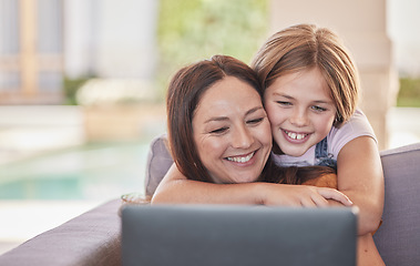 Image showing Mom, child and sofa with laptop, smile or happy for video, streaming or movie on internet. Couch, mother and daughter with hug, bonding or love for movies on web, app or subscription service in home