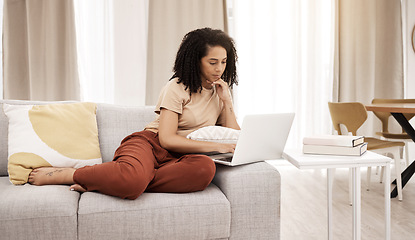 Image showing Relax, laptop and woman on a sofa in a living room for news, social media or streaming in her home. Black woman, couch and online search for educational study, upskill and training tools in Africa