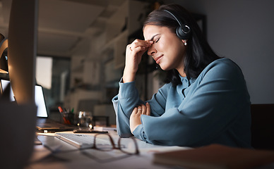 Image showing Stress, burnout and overtime, woman in call center with headache at crm office desk. Tired, frustrated and annoyed customer service consultant at computer working late at night with error or glitch.