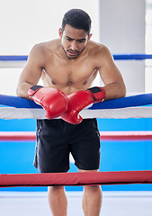 Image showing Man, tired boxer and training for boxing match, cardio fighting workout and fight exercise. Fitness sports motivation, learning to box for competition tournament and rest on rope of gym boxing ring