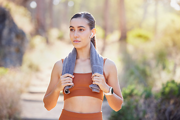 Image showing Young woman, nature and exercise, thinking of fitness and workout for wellness, health outdoor. Female athlete, healthy girl take a serious rest on running trail, walk and break for calm and relax