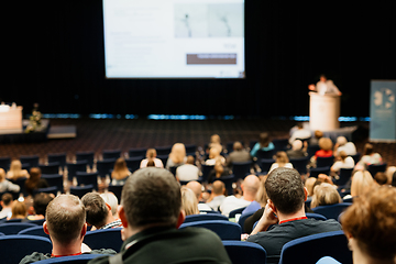 Image showing Speaker giving a talk on scientific conference. Audience at the conference hall. Business and Entrepreneurship concept.