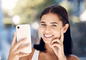 Image showing Phone, selfie and portrait of a woman in a bathroom for skincare, beauty and cleaning against blurred background mockup. Face, girl and smile for picture after facial treatment, grooming and hygiene
